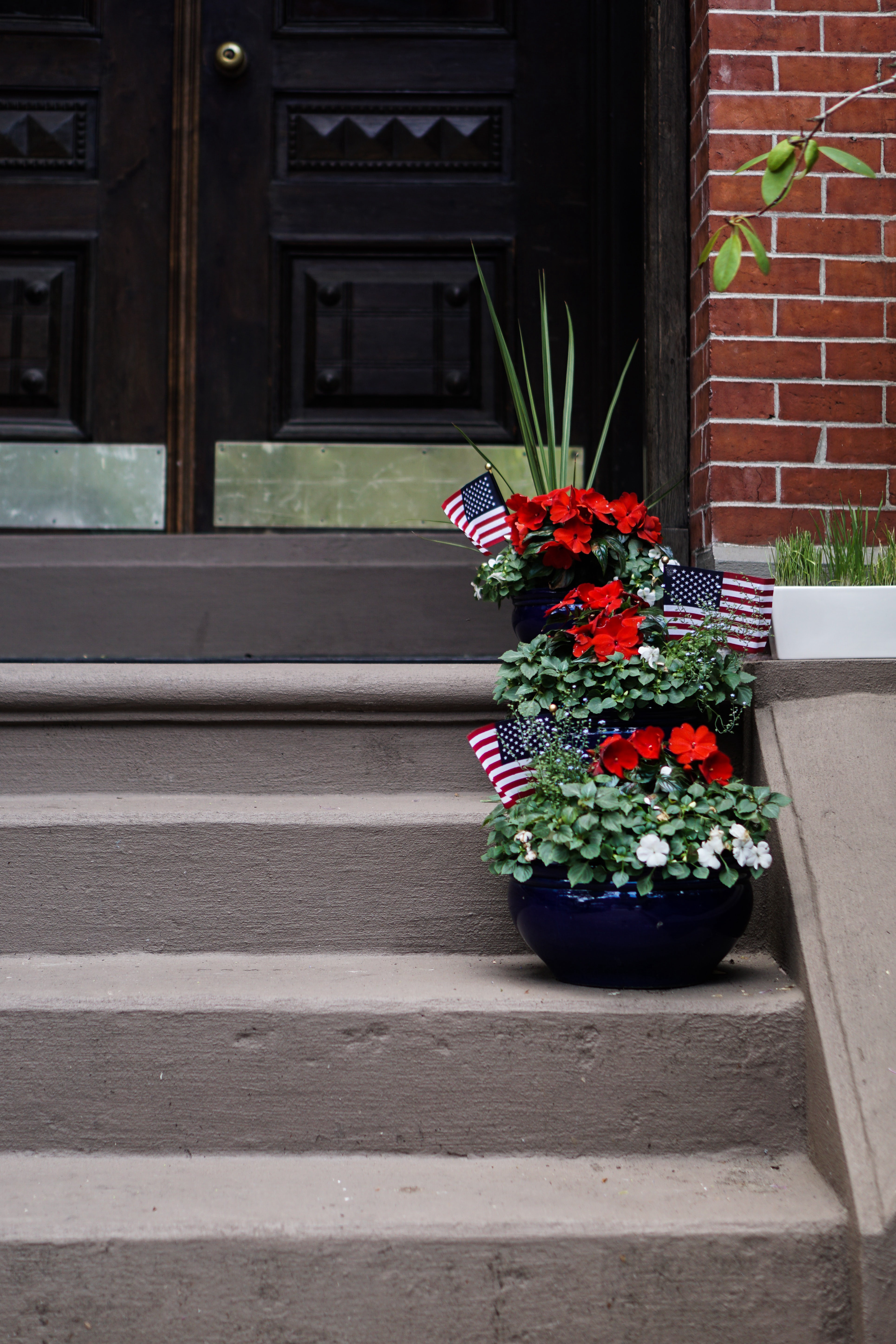 Memorial Day Flag and bouquets outside a home in South End, Boston